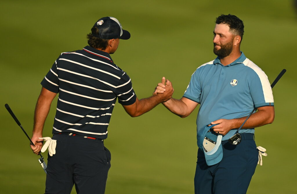 Jon Rahm and Brooks Koepka shake hands at the 2023 Ryder Cup