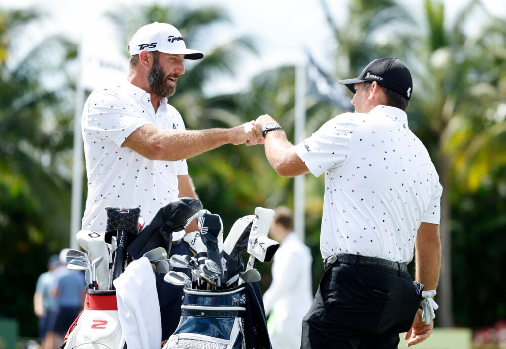 Dustin Johnson and Patrick Reed on the practice green during the pro-am prior to the LIV Golf Miami