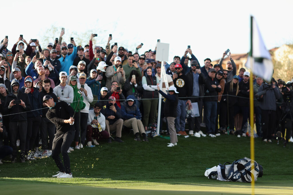 Jordan Spieth of the United States chips onto the green during the WM Phoenix Open 2014