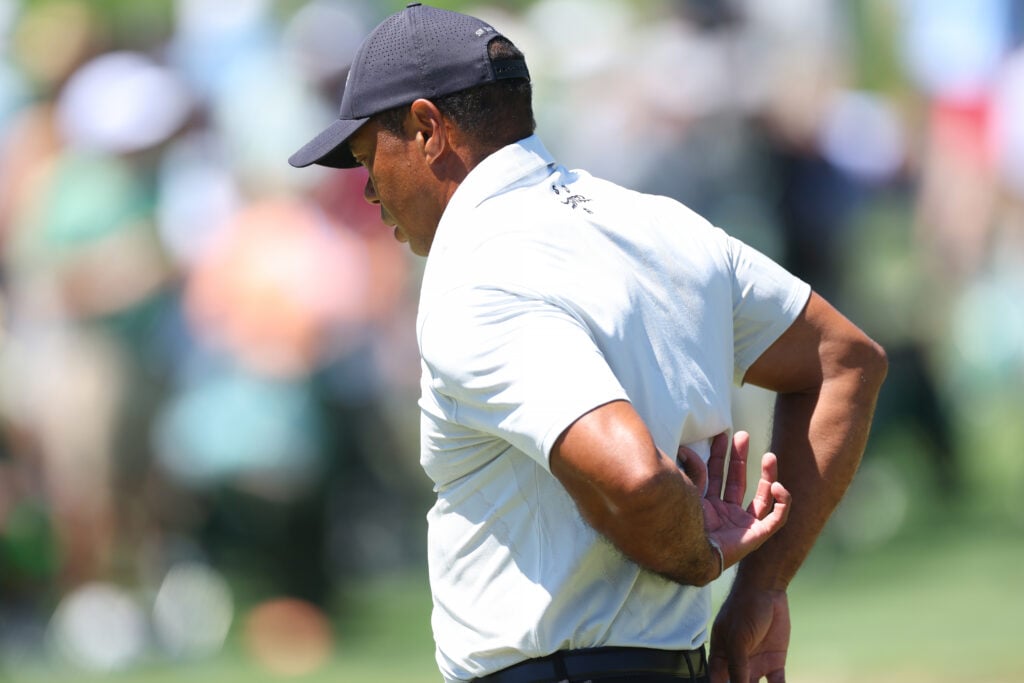 Tiger Woods feels his back during the third round of the 2024 Masters