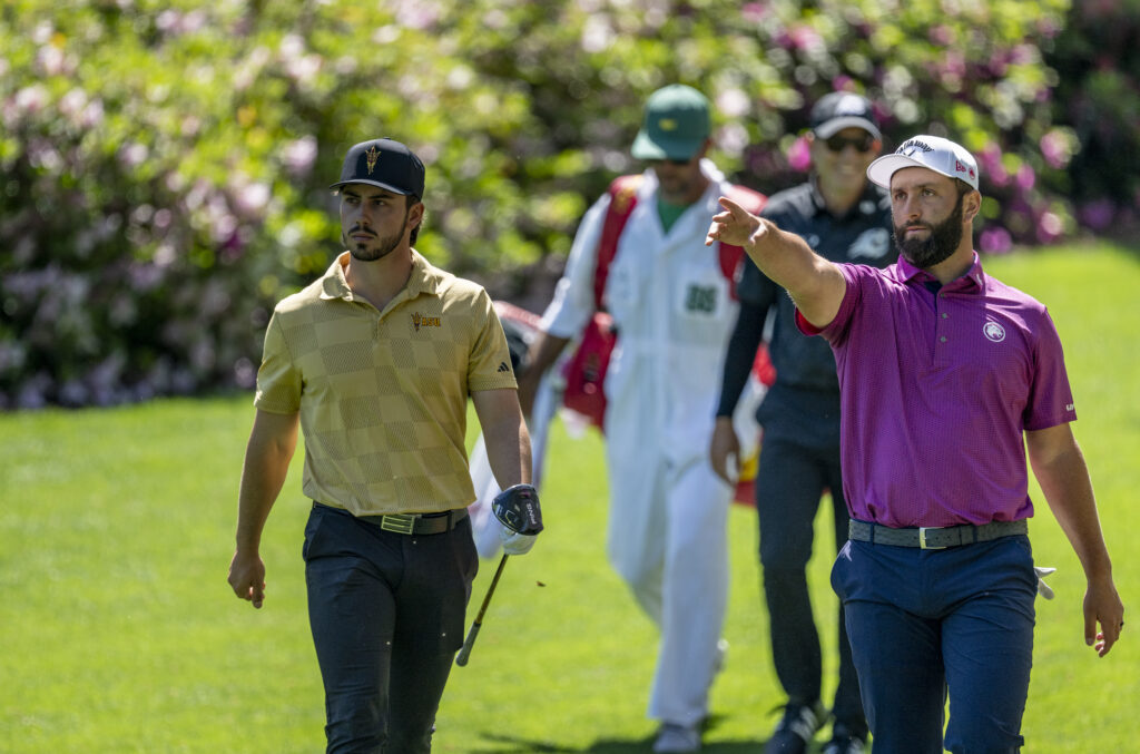 Amateur Jose Luis Ballester of Spain and Masters champion Jon Rahm of Spain on the No. 12 hole during practice round 2 prior to the Masters