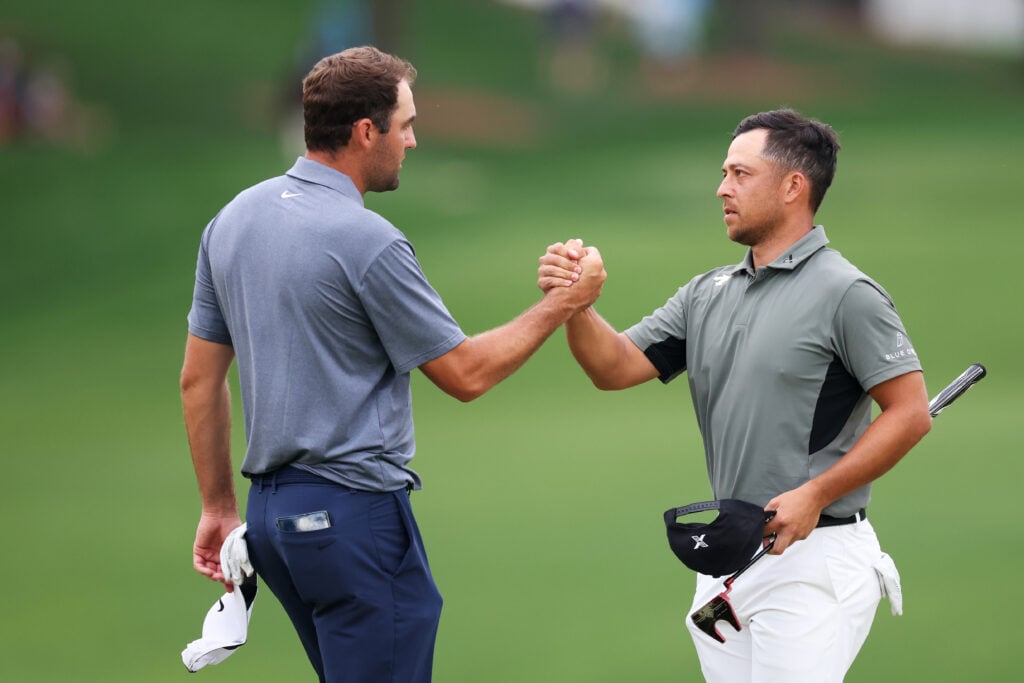 Scottie Scheffler and Xander Schauffele shake hands after the second round of the 2025 PGA Championship