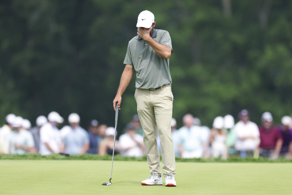 Scottie Scheffler reacts after missing a putt at the 2025 US Open.