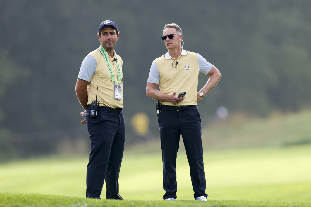 Luke Donald and Edoardo Molinari speak during a practice round ahead of the Ryder Cup