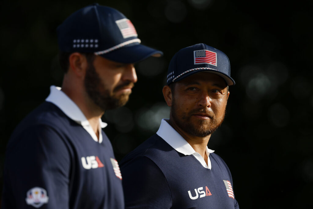 Patrick Cantlay and Xander Schauffele of Team United States look on during the Saturday morning foursomes matches of the 2025 Ryder Cup