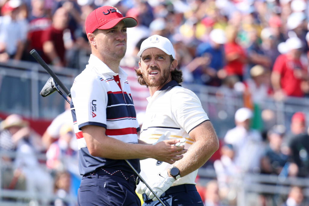 Justin Thomas and Tommy Fleetwood look on from the first tee during the Sunday singles matches of the 2025 Ryder Cup at Bethpage Black