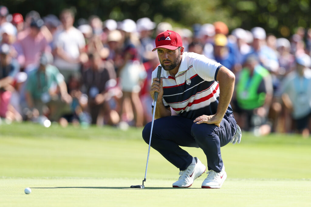 Scottie Scheffler lines up a putt during his singles match at the Ryder Cup