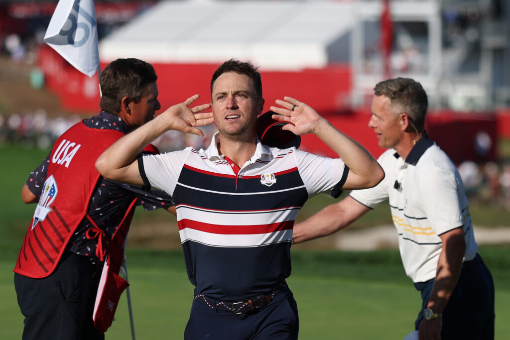 Justin Thomas of Team United States puts his hands to his ears at the 2025 Ryder Cup.