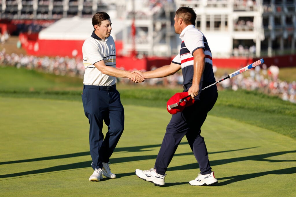 Matthew Fitzpatrick and Bryson DeChambeau shake hands after their match at the Ryder Cup