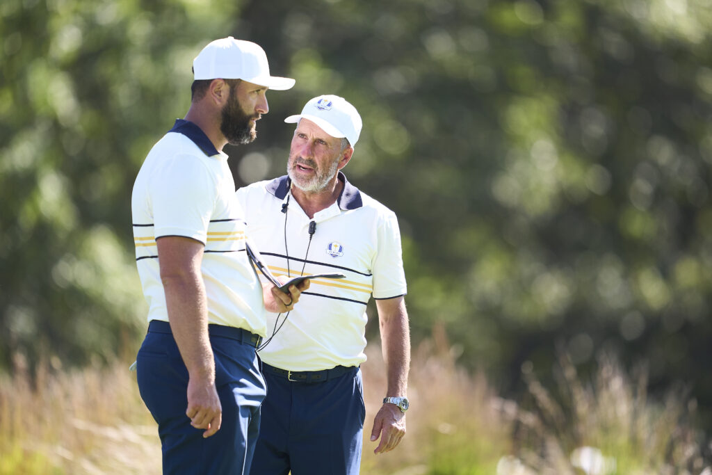 Jon Rahm converses with his Vice-Captain Jose Maria Olazabal on the seventh green during the Sunday singles matches at the Ryder Cup