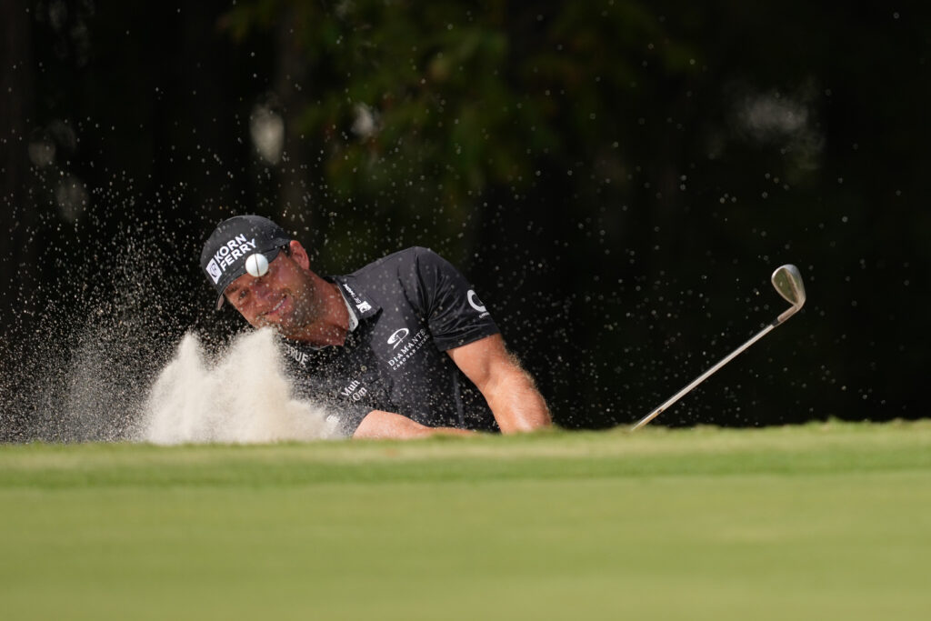 Taylor Montgomery chips out of the bunker at the Sanderson Farms Championship