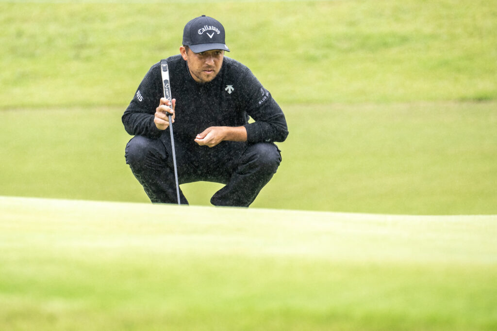 Xander Schauffele of the United States lines up a putt at the Baycurrent Classic 2025.