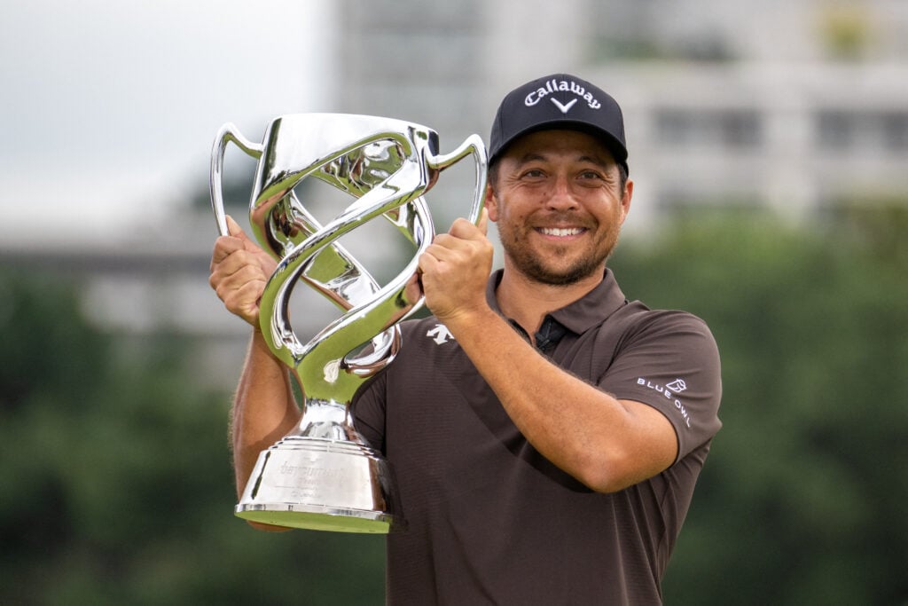 Xander Schauffele holds his trophy after winning the Baycurrent Classic