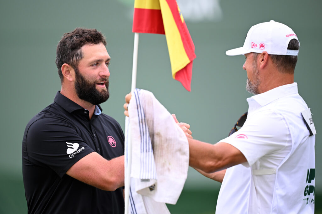 Jon Rahm of Spain and his caddie on the 18th green as he finishes his round on day four of the Open de Espana