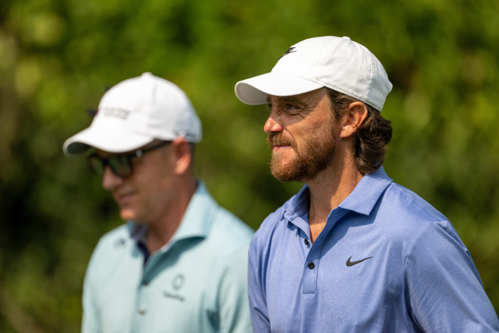 Tommy Fleetwood and Luke Donald chat during the first round of the DP World India Championship