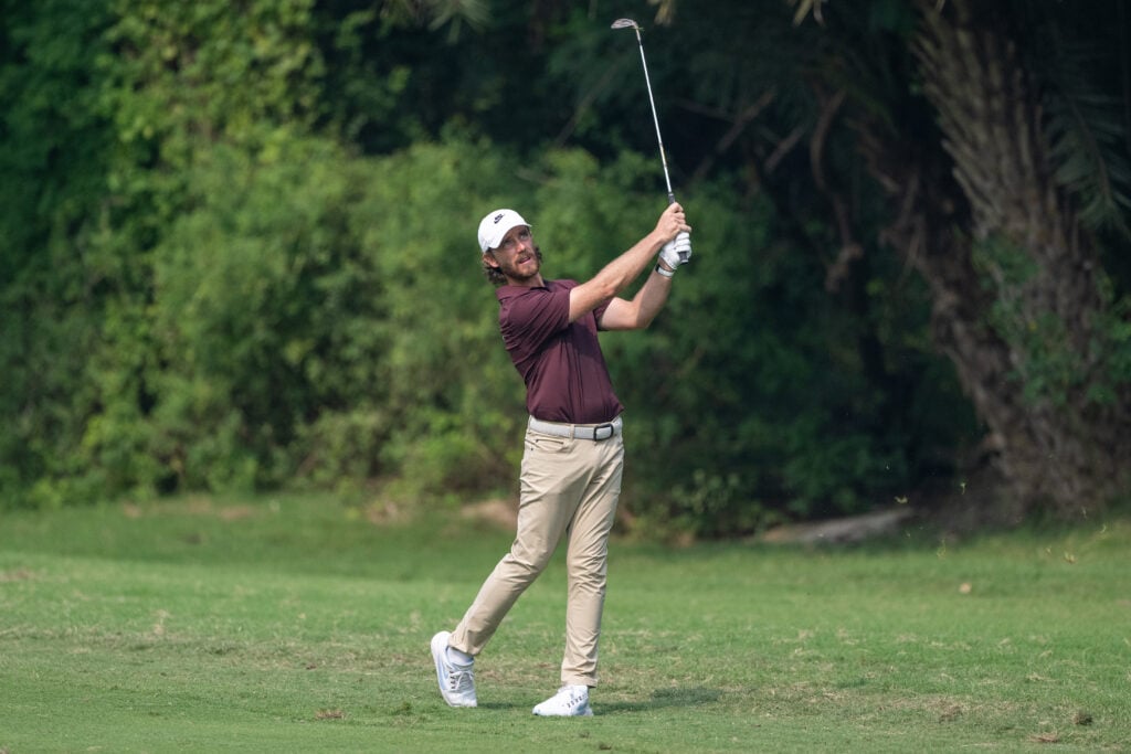 Tommy Fleetwood of England plays his approach at the DP World India Championship 2025