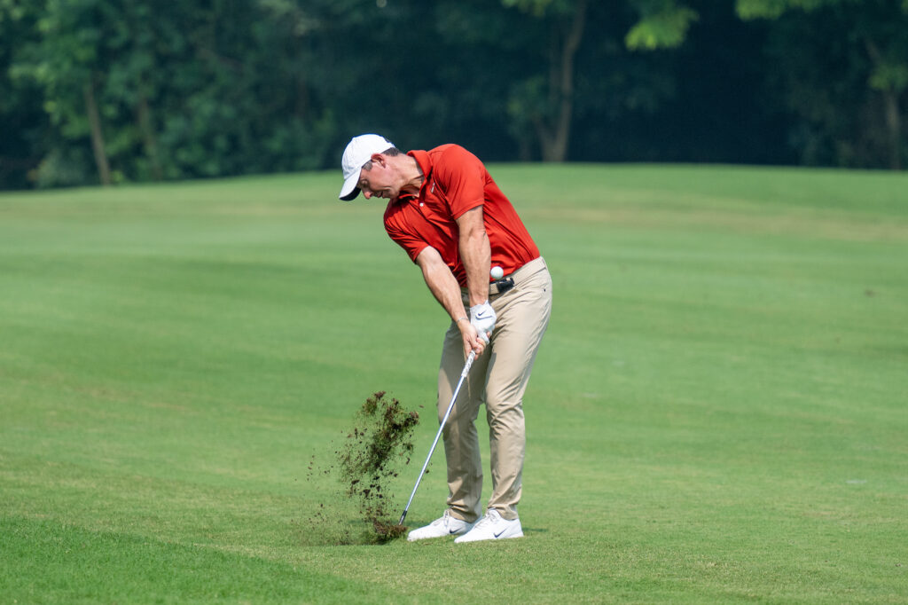 Rory McIlroy of Northern Ireland plays his approach at the DP World India Championship 2025
