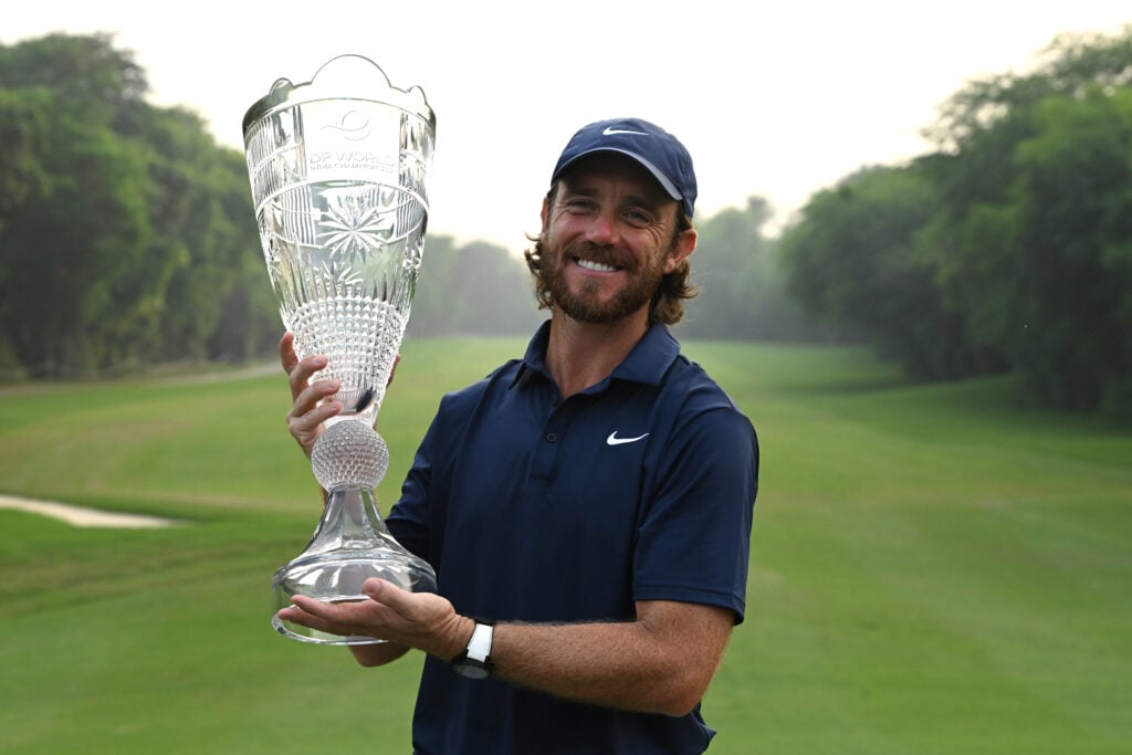 Tommy Fleetwood holds the trophy after winning the DP World India Championship