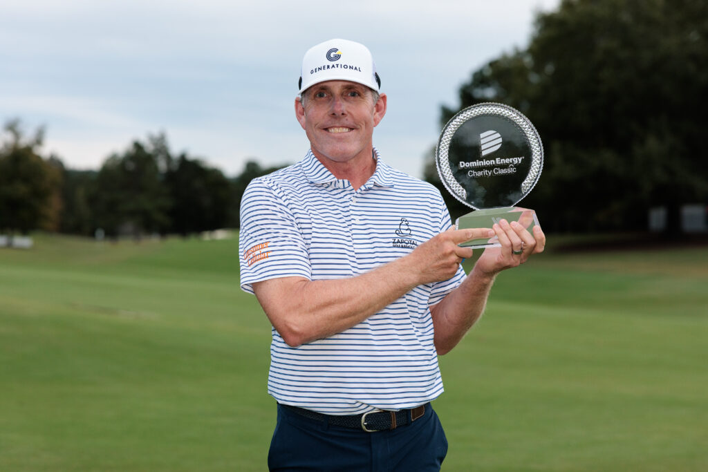 Justin Leonard of the United States poses for a photo with the trophy after winning the Dominion Energy Charity Classic 2025