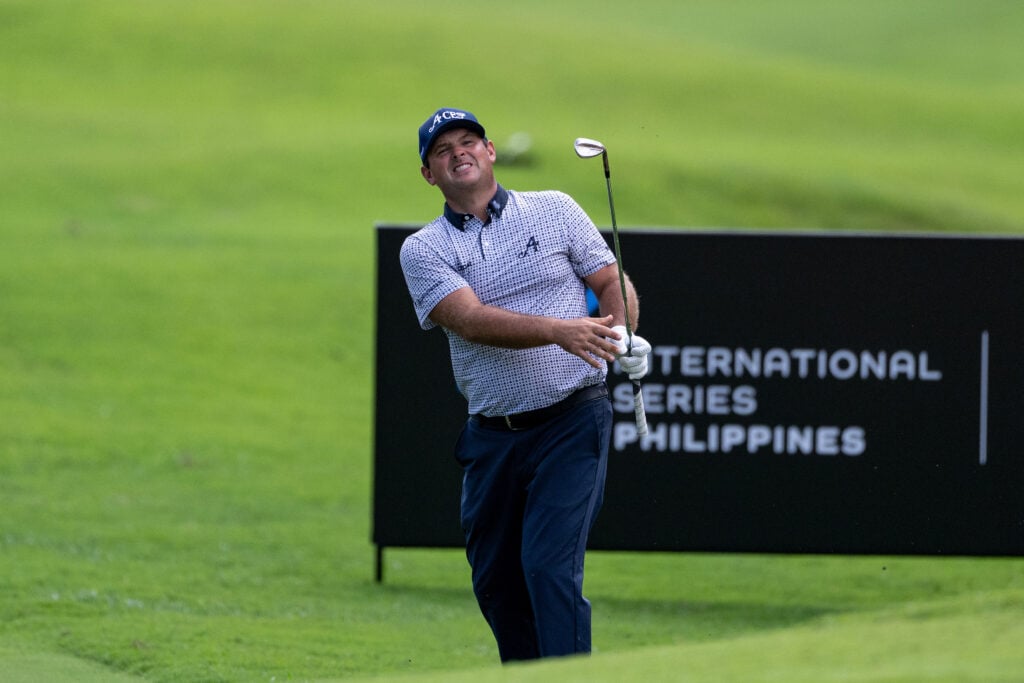 Patrick Reed hits an iron shot during the second round of the International Series Philippines