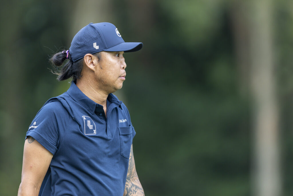 Anthony Kim walks down the fairway during round one of the Link Hong Kong Open