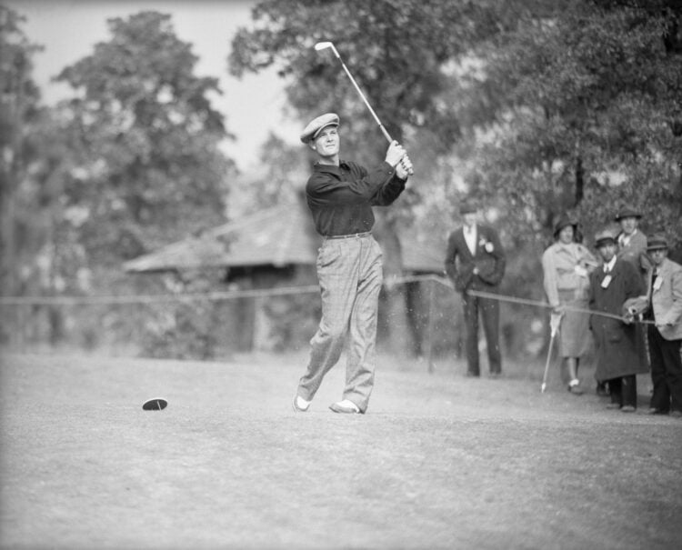 (Original Caption) 11/19/36-Pinehurst, North Carolina: Jimmy DeMaret, of Houston, Texas, driving from the 17th green in his match with Tony Manero,...