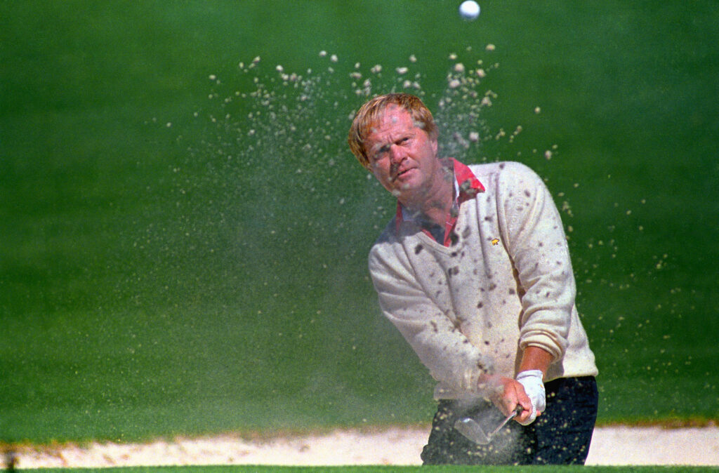 Jack Nicklaus plays a shot out of a bunker at the Masters.