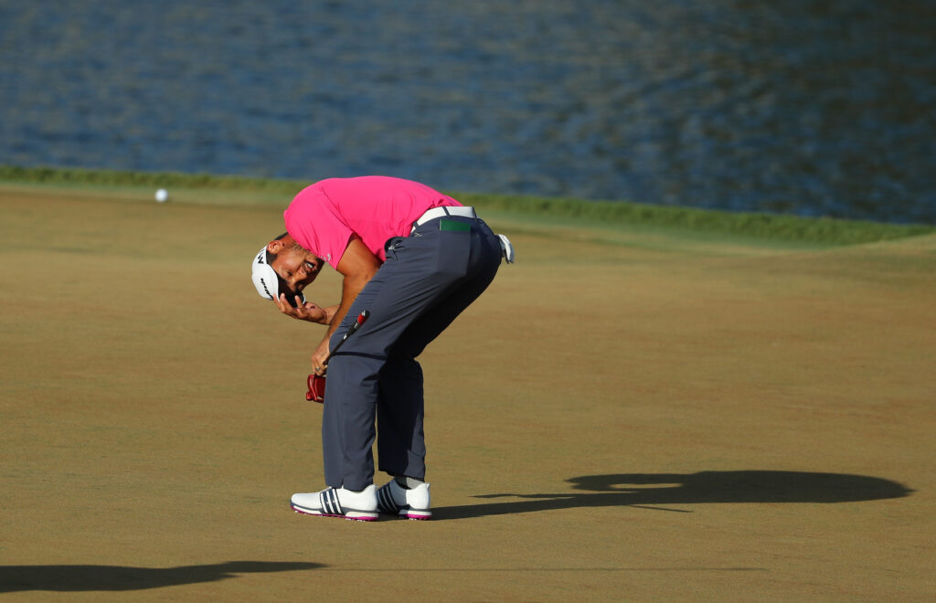 Jason Day reacts to his putt on the 17th hole during the final round of The Players Championship