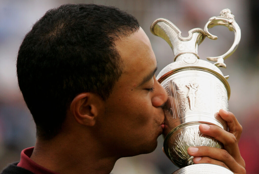 Tiger Woods kisses the Claret Jug after winning The Open in 2005