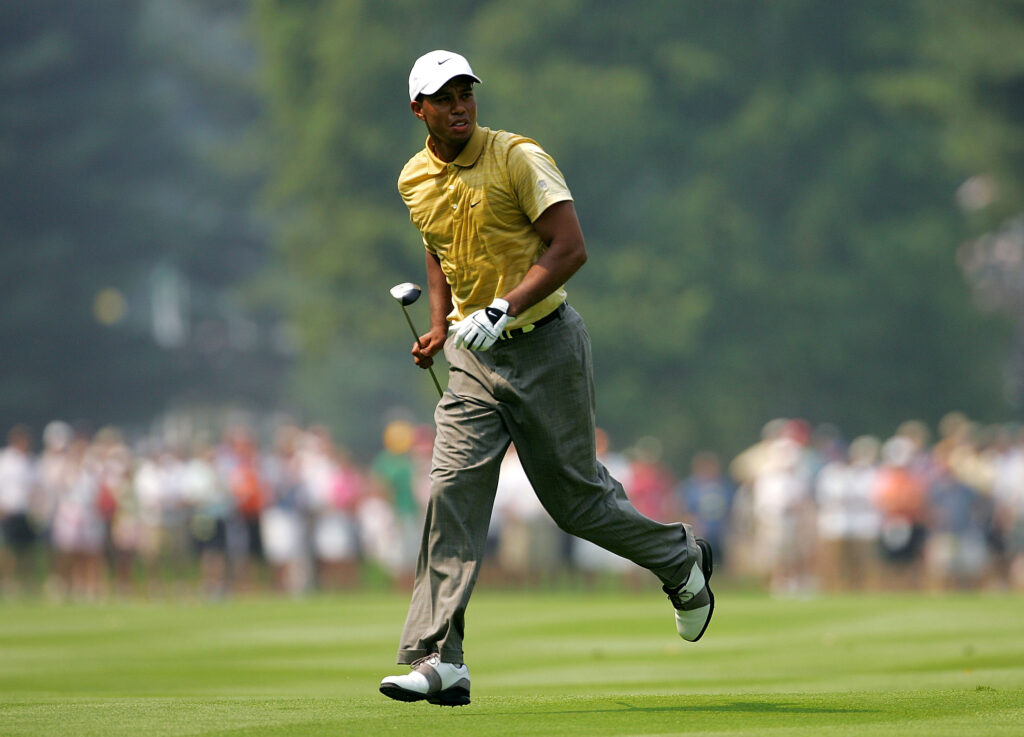 Tiger Woods runs to watch his approach shot during the third round of the 2005 PGA Championship