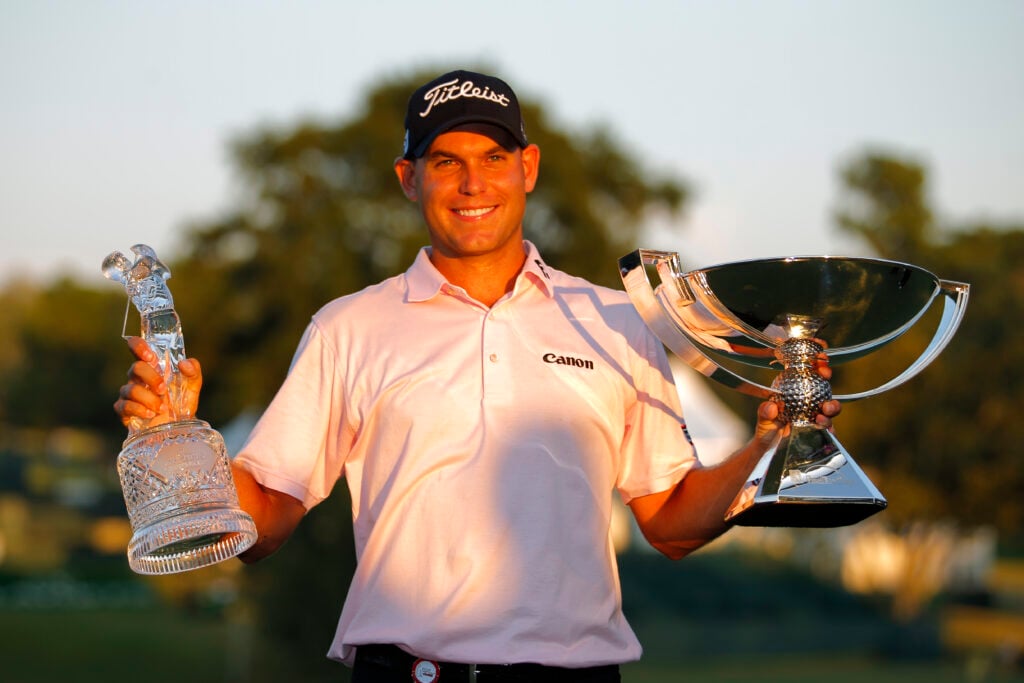 Bill Haas holds the trophies after winning in the final round of the FedEx Cup - The Tour Championship at East Lake