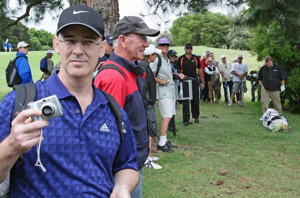 Golf fan Brad Clegg displays his camera after it was smashed against a tree by John Daly during the Australian Open at the Royal Sydney Golf Club
