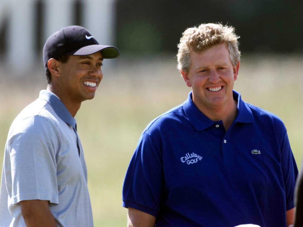 Tiger Woods of the United States (left) shares a joke with Colin Montgomerie of Scotland during practice for the Open Championship