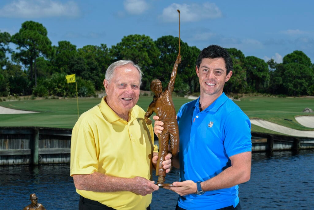 Jack Nicklaus poses with Rory McIlroy of Northern Ireland and the Player of the Year trophy during the Player of the Year ceremony at The Bear's Club