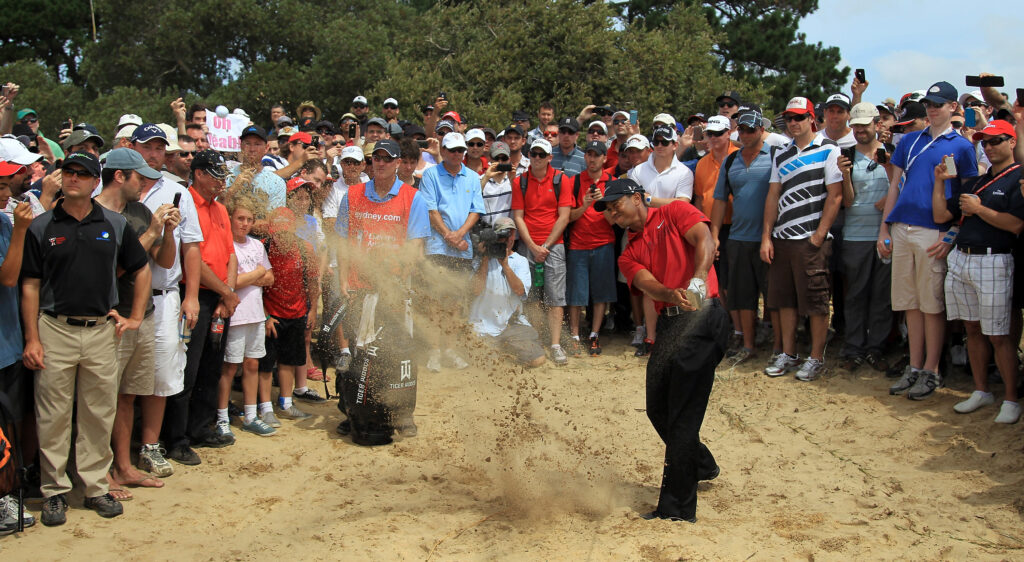 Tiger Woods plays a shot from the sand at the 2011 Australian Open