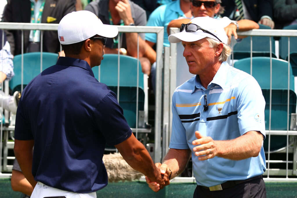 Tiger Woods of the U.S. Team and International Team captain Greg Norman shake hands at the 2011 Presidents Cup