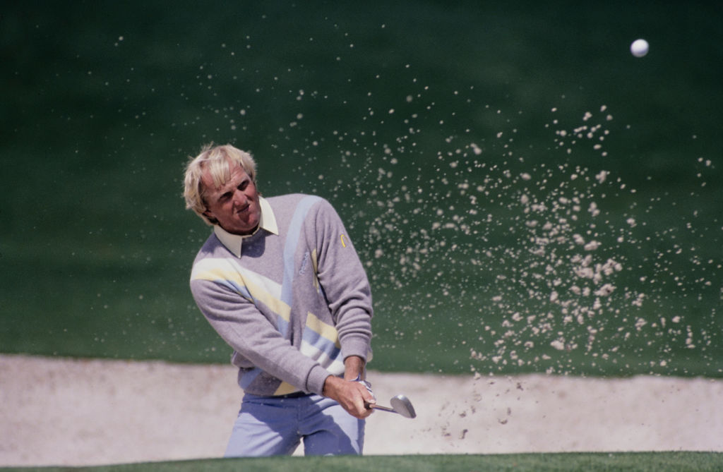 Greg Norman from Australia chips out of the sand bunker on 6th April 1989 during the Masters