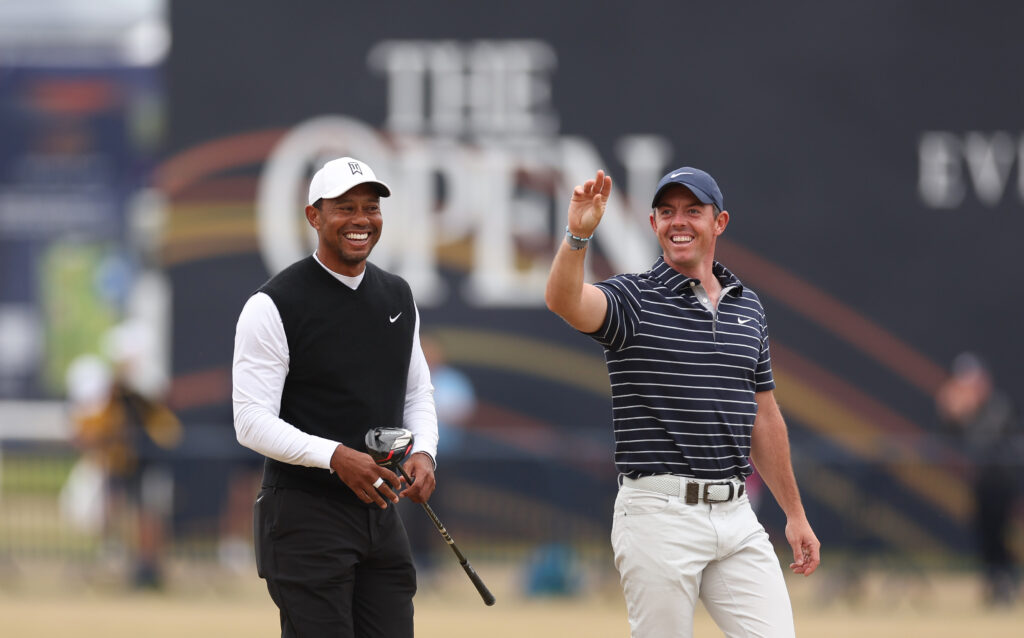 Tiger Woods of The USA and Rory McIlroy of Northern Ireland smile during the 2022 Open Championship