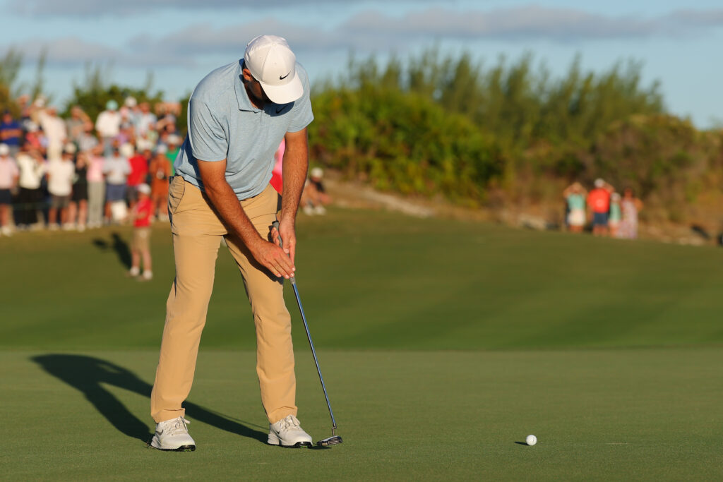 Scottie Scheffler hits a putt during the final round of the 2024 Hero World Challenge