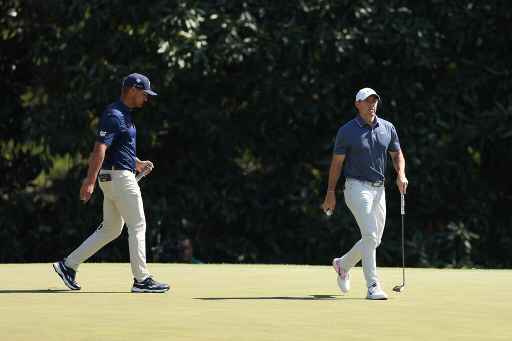 Bryson DeChambeau and Rory McIlroy walk on the fifth green during the final round of The Masters