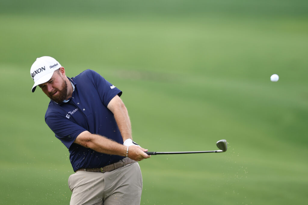 Shane Lowry of Ireland hits a chip shot on the 14th hole prior to the PGA Championship at Quail Hollow