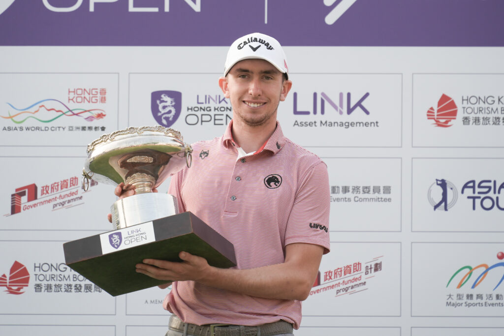 Tom McKibbi lifts the Link Hong Kong Open Trophy during a ceremony following the final round of the Link Hong Kong Open