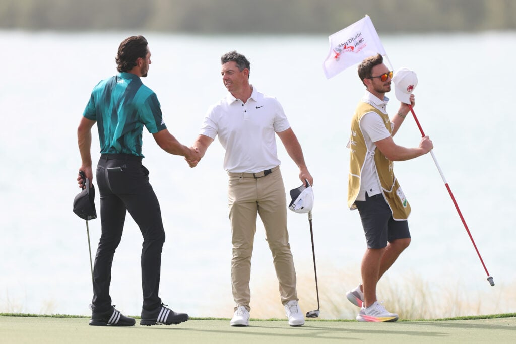 Marco Penge and Rory McIlroy after finishing their round on day one of the Abu Dhabi HSBC Championship