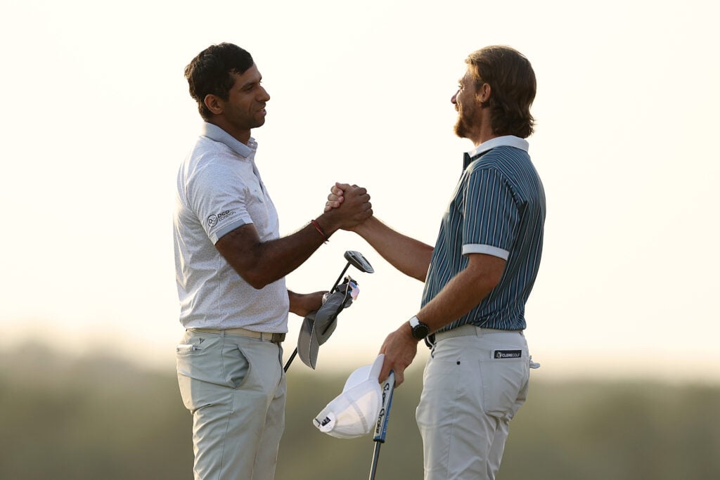 Aaron Rai and Tommy Fleetwood embrace at the 2025 Abu Dhabi HSBC Championship