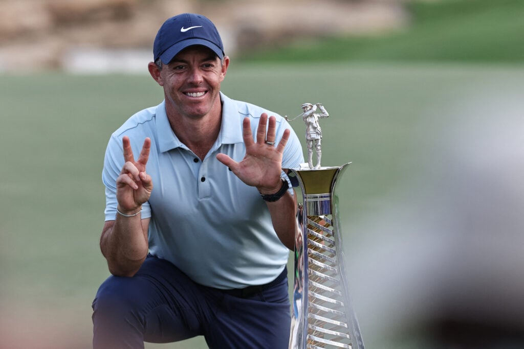 Rory McIlroy celebrates with the trophy after winning the Race to Dubai for a seventh time