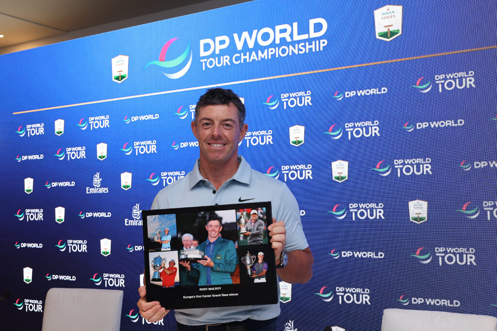 Rory McIlroy poses with his career grand slam award after the DP World Tour Championship in 2025