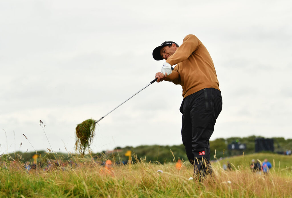 Adam Scott of Australia hits a shot from the rough at the 2017 Open Championship
