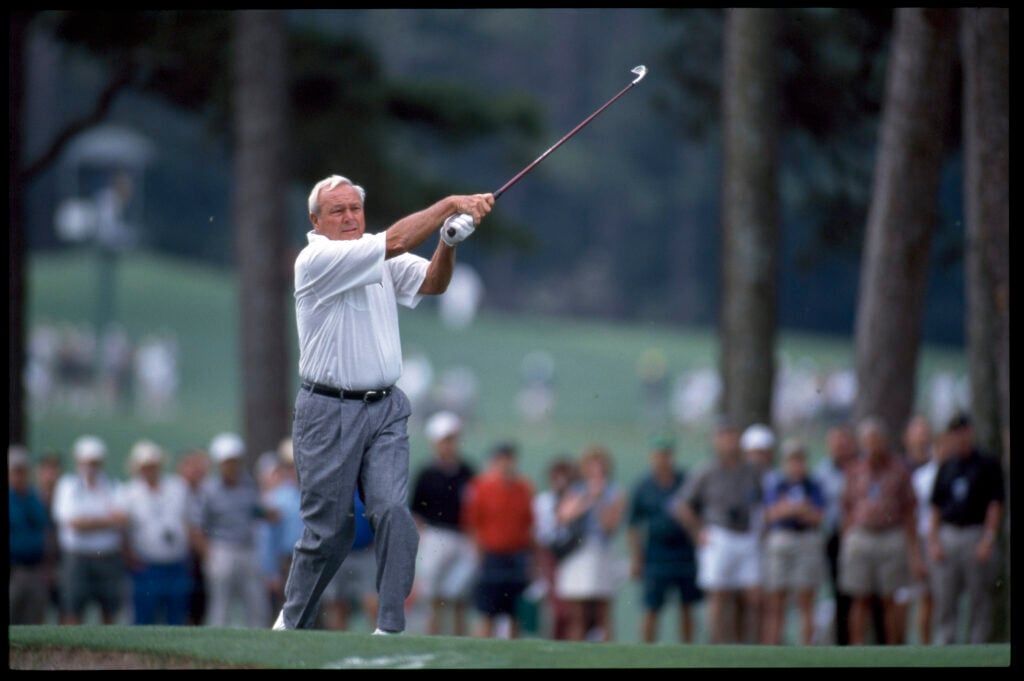Arnold Palmer hits an iron shot during the second round of The Masters in 2001