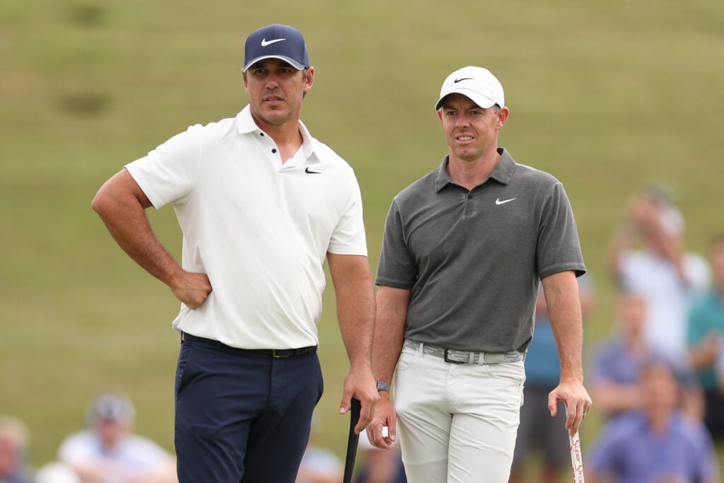 Brooks Koepka of the United States and Rory McIlroy of Northern Ireland on the 11th green during the first round of the 123rd U.S. Open Championship 2023