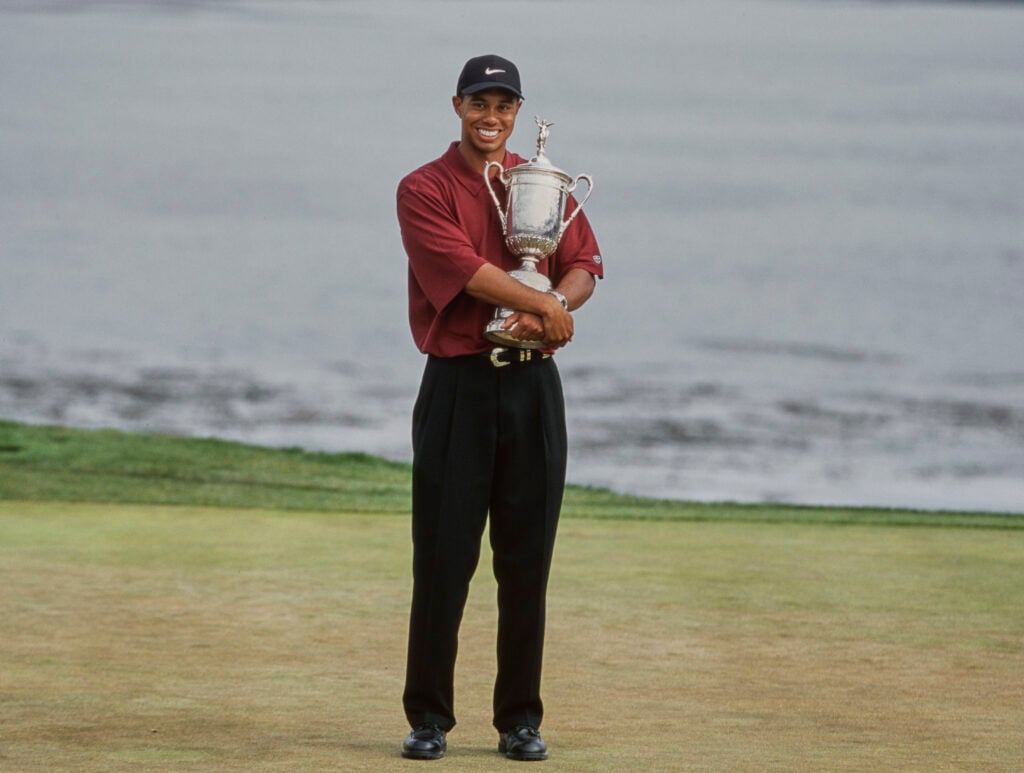 Tiger Woods holding the US Open trophy after his victory at Pebble Beach in 2000